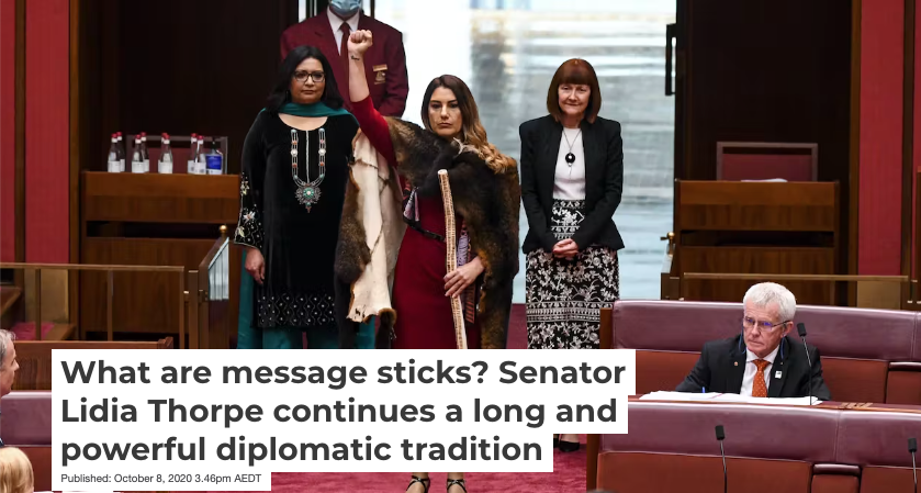 Banner image from The Conversation article with the head line "What are message sticks? Senator Lidia Thorpe continues a long and powerful diplomatic tradition